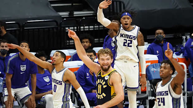 Kings forward Richaun Holmes (22) guard Buddy Hield (24) guard Tyrese Haliburton (0) and Pacers forward Domantas Sabonis (11)